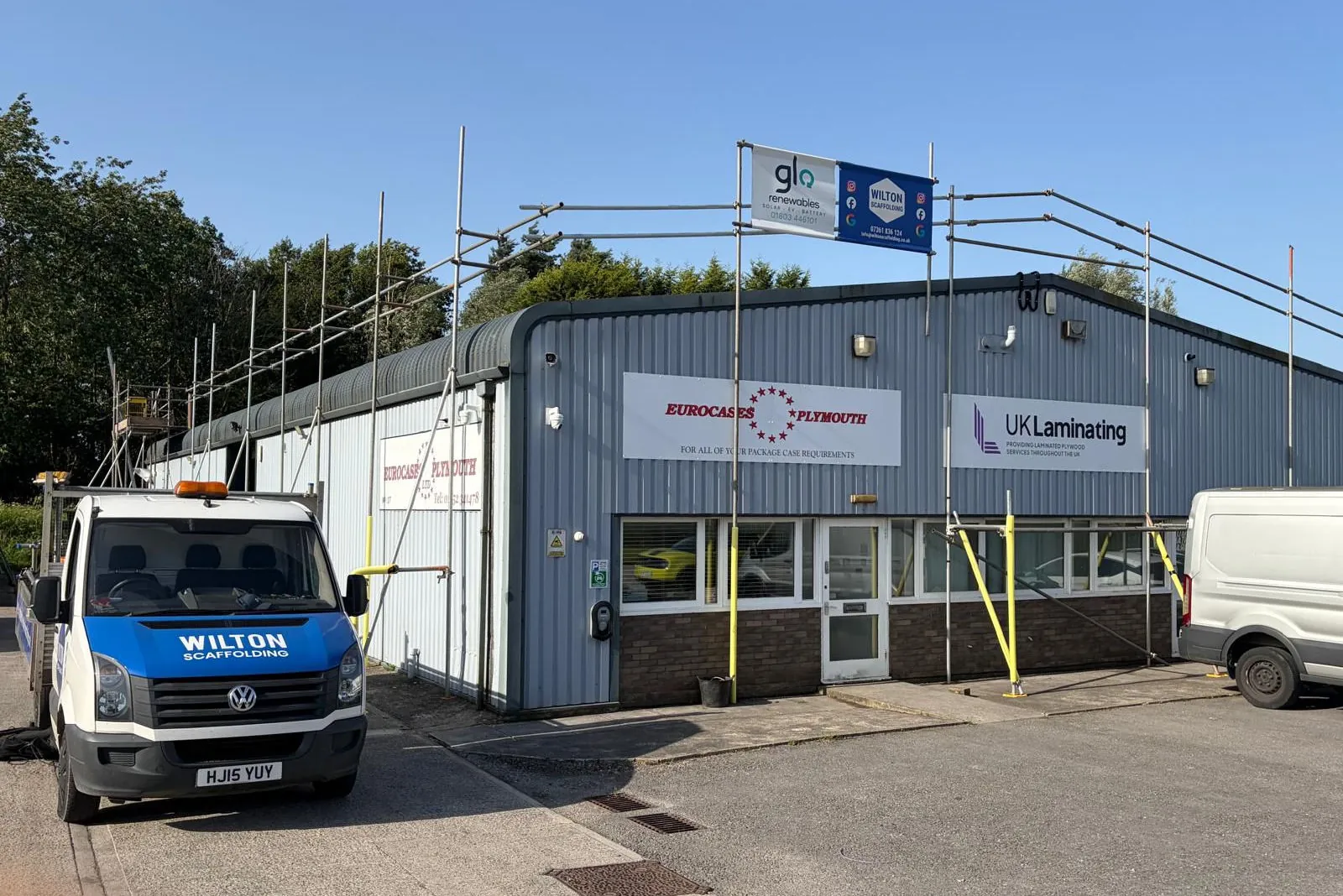 Scaffolding around warehouse style building for a commercial business.
